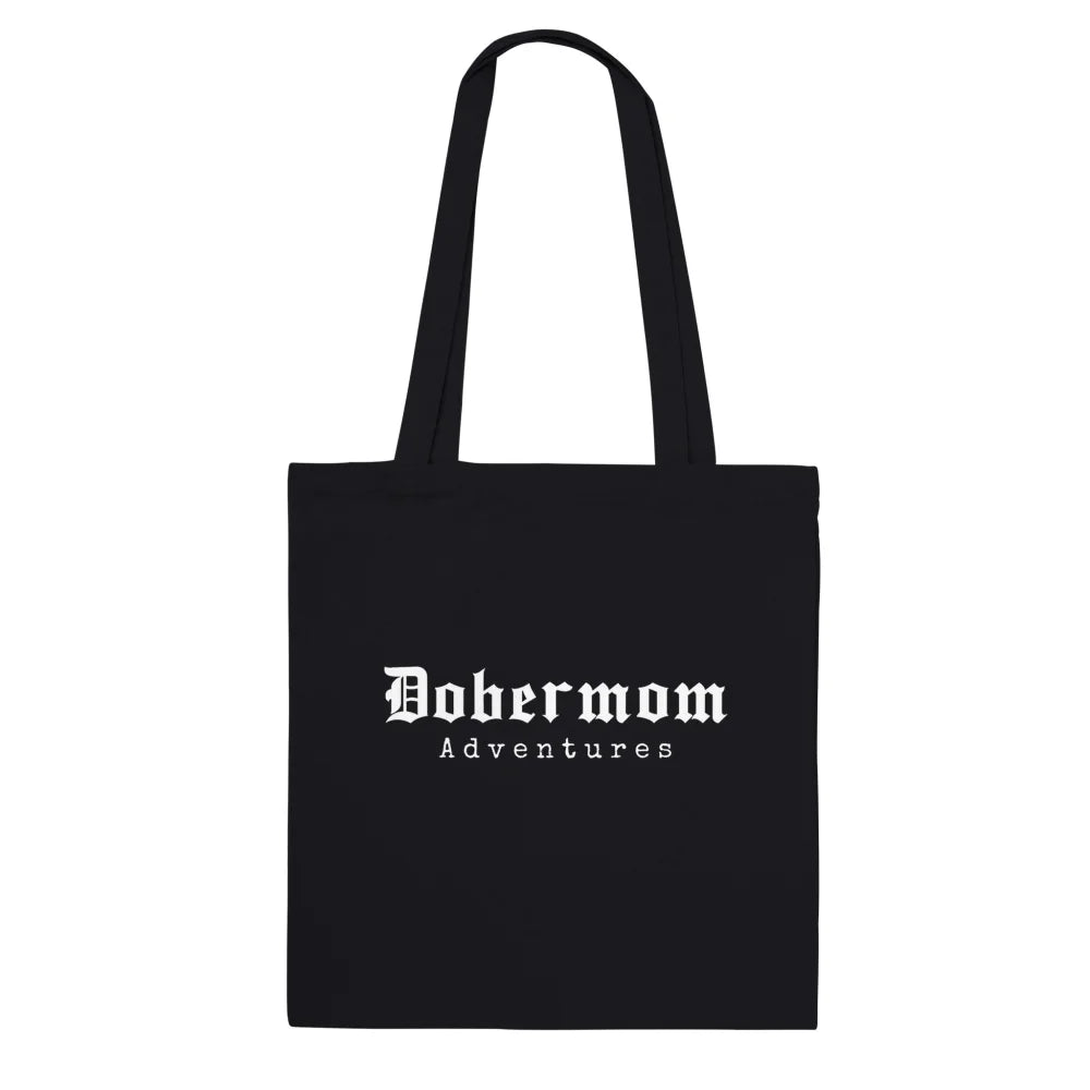 Sac fourre-tout noir avec ’Dobermom Adventures’ imprimé en blanc.